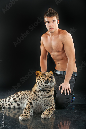 Photo: young man with leopard young man with leopard