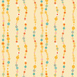 Seamless pattern with colored beads on yellow background