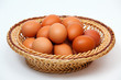 Colored eggs in straw plate
