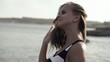 Young woman by the sea, super slow motion, shot at 240fps