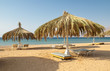 Sandy beaches with umbrella and sunbeds