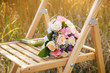bouquet of the bride executed from light pink and beige roses