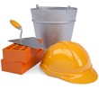 Building bricks, hard hat, trowel and a bucket