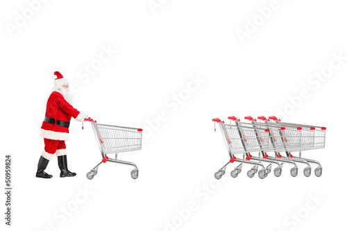 Photo: Full length portrait of a Santa Claus returning an empty shoppin Full length portrait of a Santa Claus returning an empty shoppin