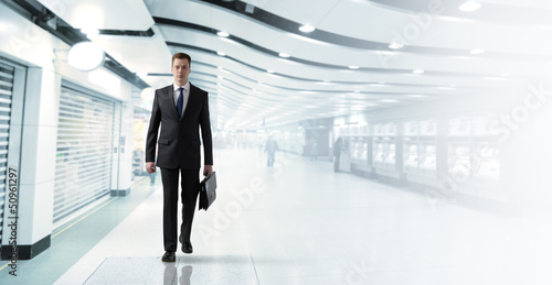 Photo: business man walking in subway business man walking in subway