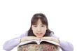 A smile and cute Asian girl seriously learning