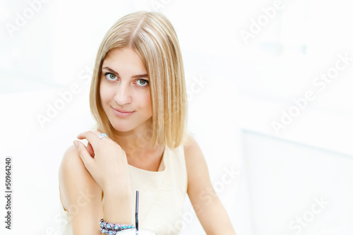 Photo: Young woman in cafe Young woman in cafe
