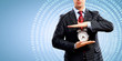 Business man holding alarmclock