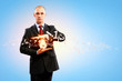 Business man holding alarmclock