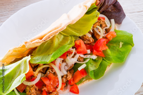 Photo: Kebab - grilled meat, bread and vegetables Kebab - grilled meat, bread and vegetables