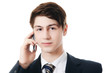 Foto: The businessman in business suit speaks by phone The businessman in business suit speaks by phone
