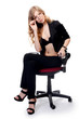 Businesswoman in an armchair isolated on white background