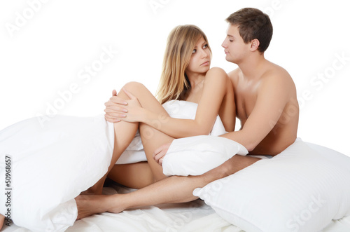 Photo: Beautiful pair lays in a bed Beautiful pair lays in a bed