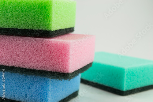 Photo: kitchen sponges isolated on a white background kitchen sponges isolated on a white background