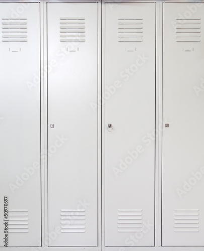 Photo: Empty white school metal lockers Empty white school metal lockers