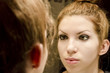 Young woman in the mirror