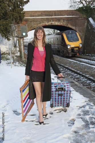 Photo: Holidaymaker departing the cold English weather by train Holidaymaker departing the cold English weather by train