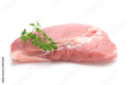Photo: Fresh pork with italian parsley on white background Fresh pork with italian parsley on white background