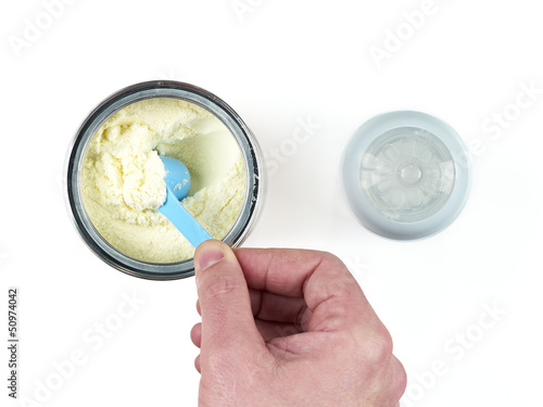 Photo: Powdered milk dairy food for baby and Baby bottle. Powdered milk dairy food for baby and Baby bottle.