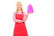 Housewife  holding a bottle of detergent and posing
