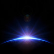 Earth sunrise with rays and lens flare