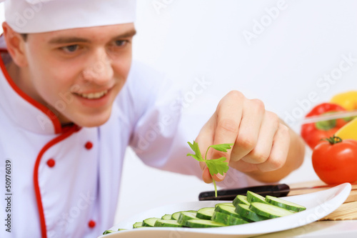 Photo: Young cook preparing food Young cook preparing food