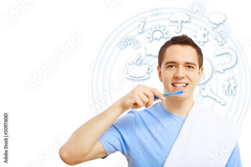 Photo: Young man with tooth brush Young man with tooth brush