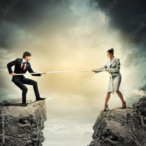 Photo: People pull the rope. People pull the rope.