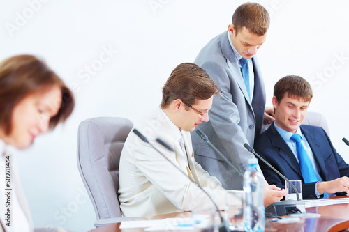 Photo: Four businesspeople at meeting Four businesspeople at meeting