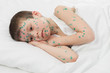 sick boy in white bed