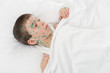 sick boy in white bed