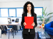 Young businesswoman in her office