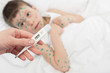 temperature measurement sick boy in bed