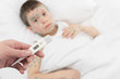 temperature measurement sick boy in bed