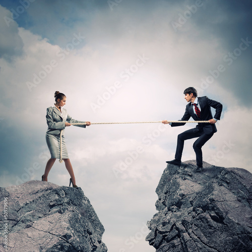 Photo: People pull the rope. People pull the rope.