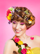 young woman with bright glamour makeup and flowers