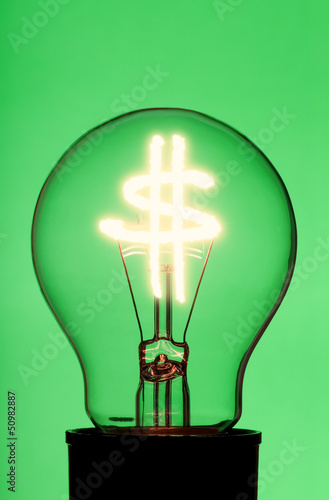 Photo: light bulb with glowing dollar symbol light bulb with glowing dollar symbol