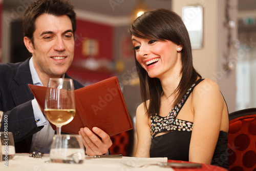 Photo: Couple reading the menu Couple reading the menu