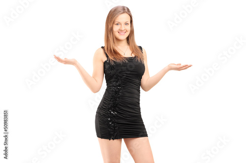 Photo: Beautiful young female in black dress gesturing with her hands Beautiful young female in black dress gesturing with her hands