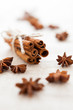 Pile of cinnamon sticks and cloves on homemade canvas