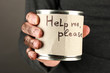 homeless man asks for help, on black background close-up