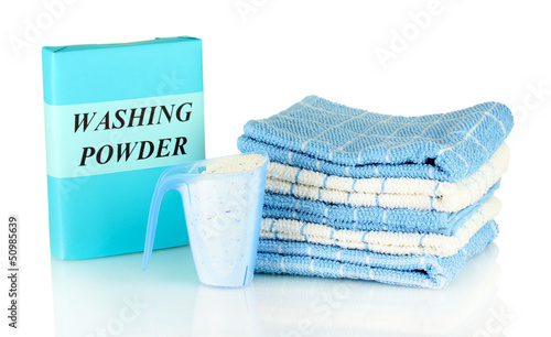 Photo: Box of washing powder with blue measuring cup and towels, Box of washing powder with blue measuring cup and towels,