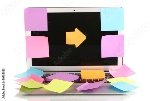 Photo: Laptop with empty stickers isolated on white Laptop with empty stickers isolated on white