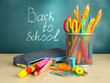 Back to school - blackboard with pencil-box and school