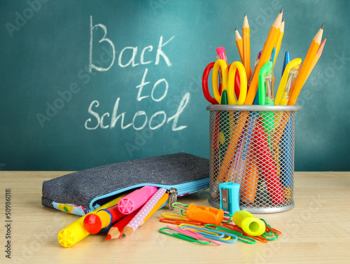 Photo: Back to school - blackboard with pencil-box and school Back to school - blackboard with pencil-box and school