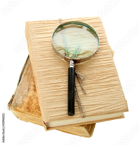 Photo: Magnifying glass and book isolated on white Magnifying glass and book isolated on white
