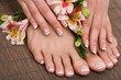 Beautiful woman legs and hands on bamboo mat