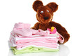 Pile of baby clothes isolated on white