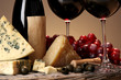 Refined still life of wine, cheese and grapes