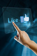 a woman finger select and like  on a english digital screen